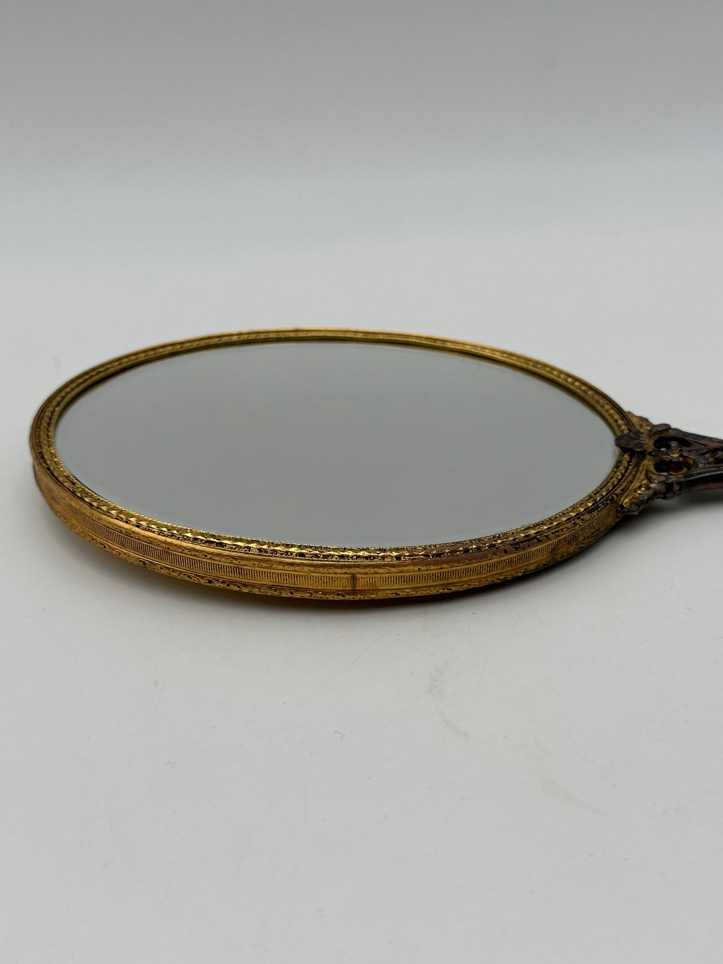 Brass Tone Vintage Hand-Held Beveled Edge Oval Vanity Mirror