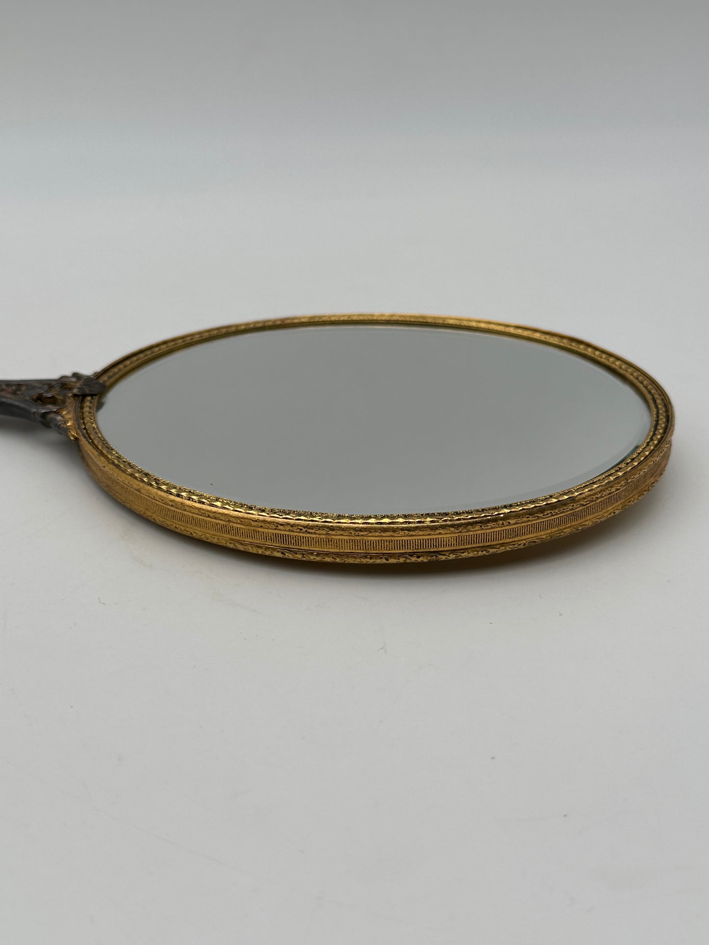 Brass Tone Vintage Hand-Held Beveled Edge Oval Vanity Mirror