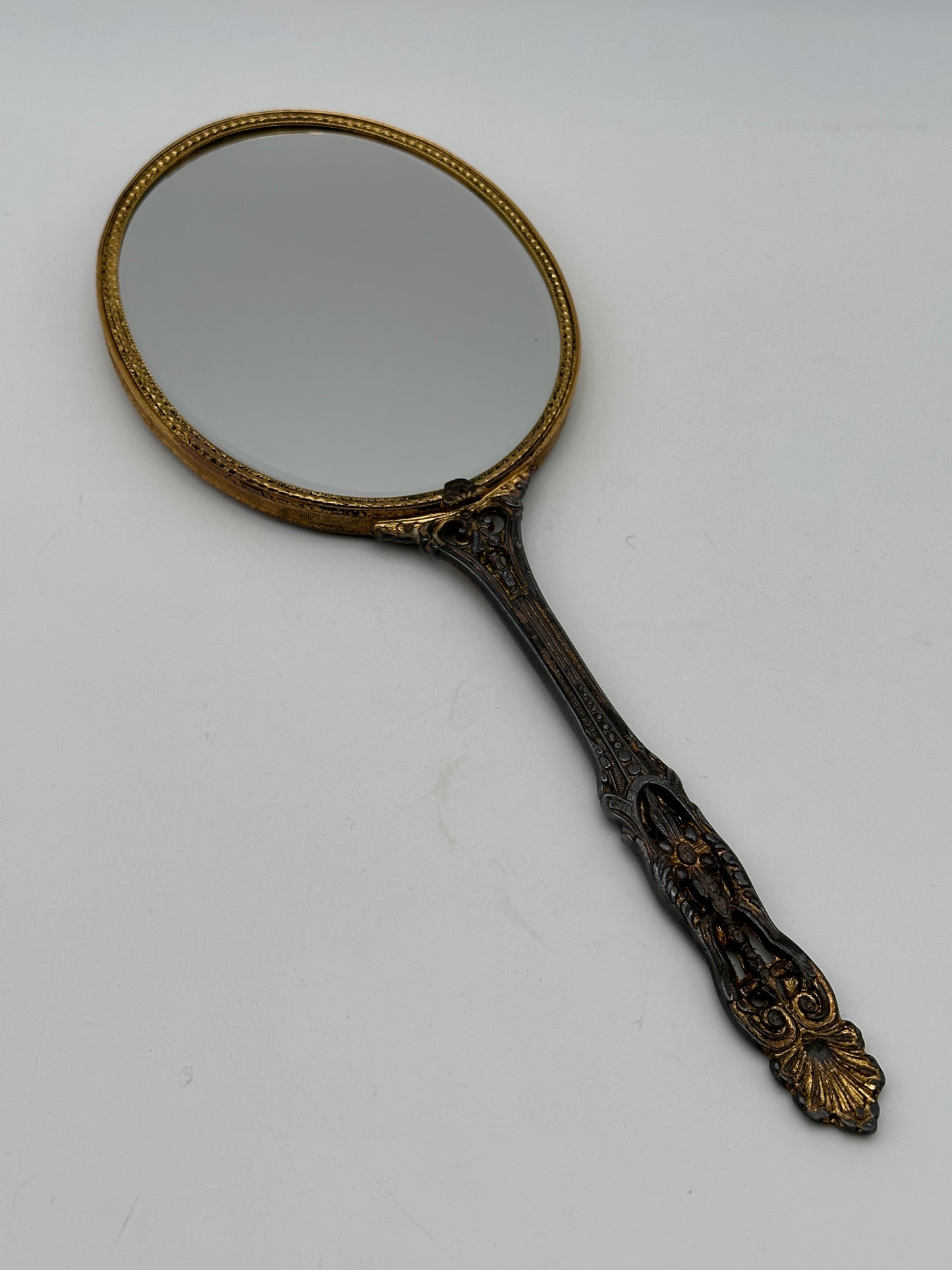 Brass Tone Vintage Hand-Held Beveled Edge Oval Vanity Mirror